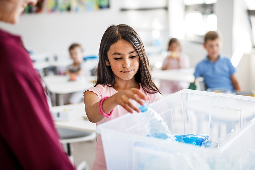 Young-girl-recycling-bottle