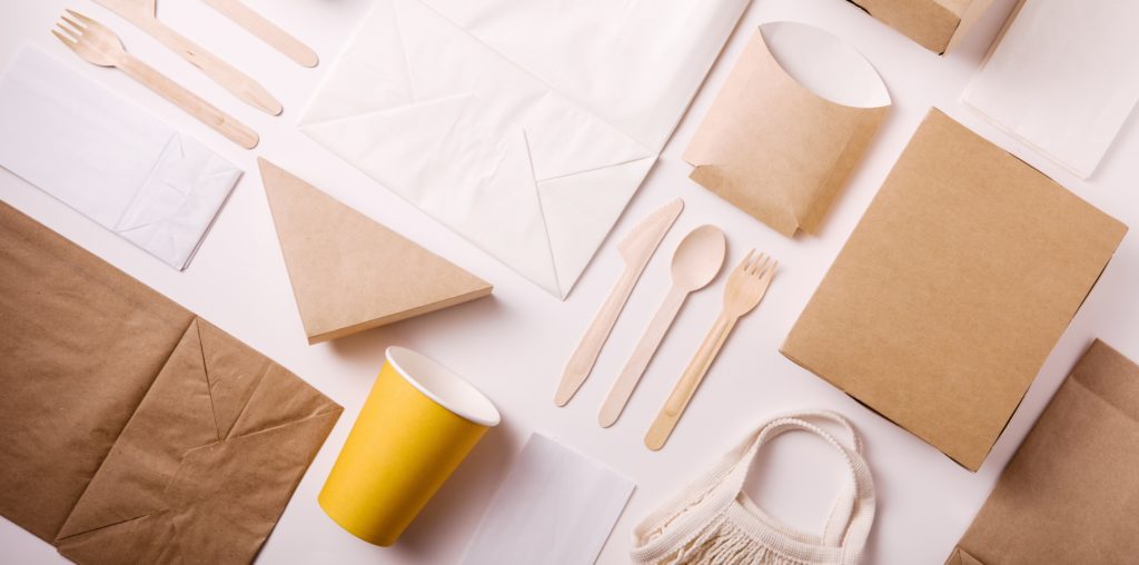 Top view and flat lay concept of Eco friendly, kraft, disposable, recyclable tableware. Paper food boxes, dishes on white background