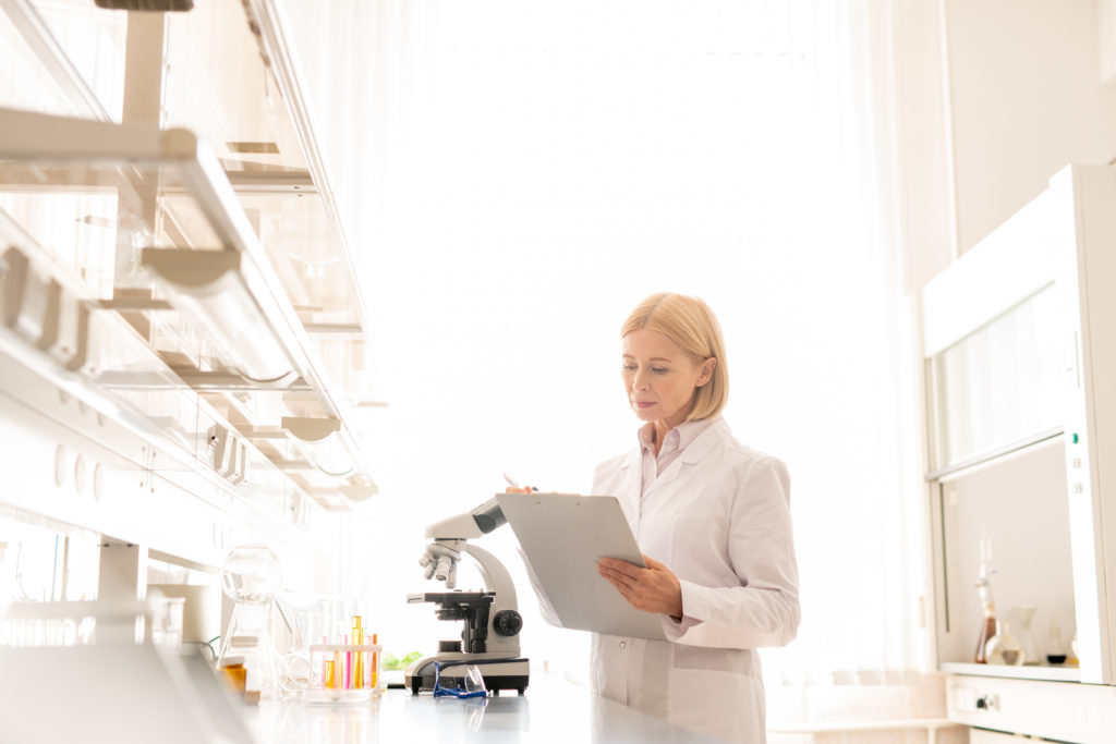 Scientist checking information before experiment