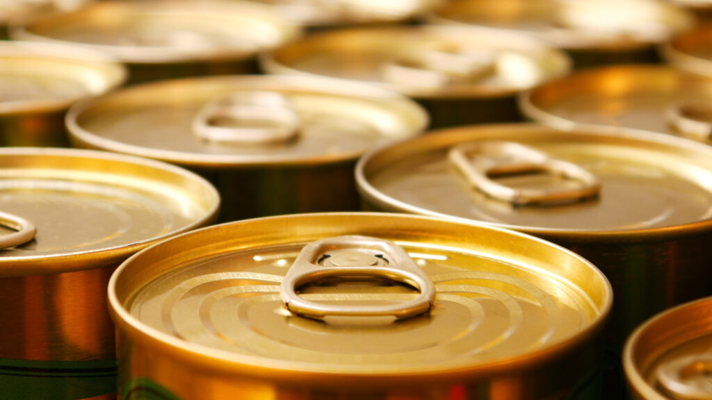 Close-up of many beautiful cans of canned food