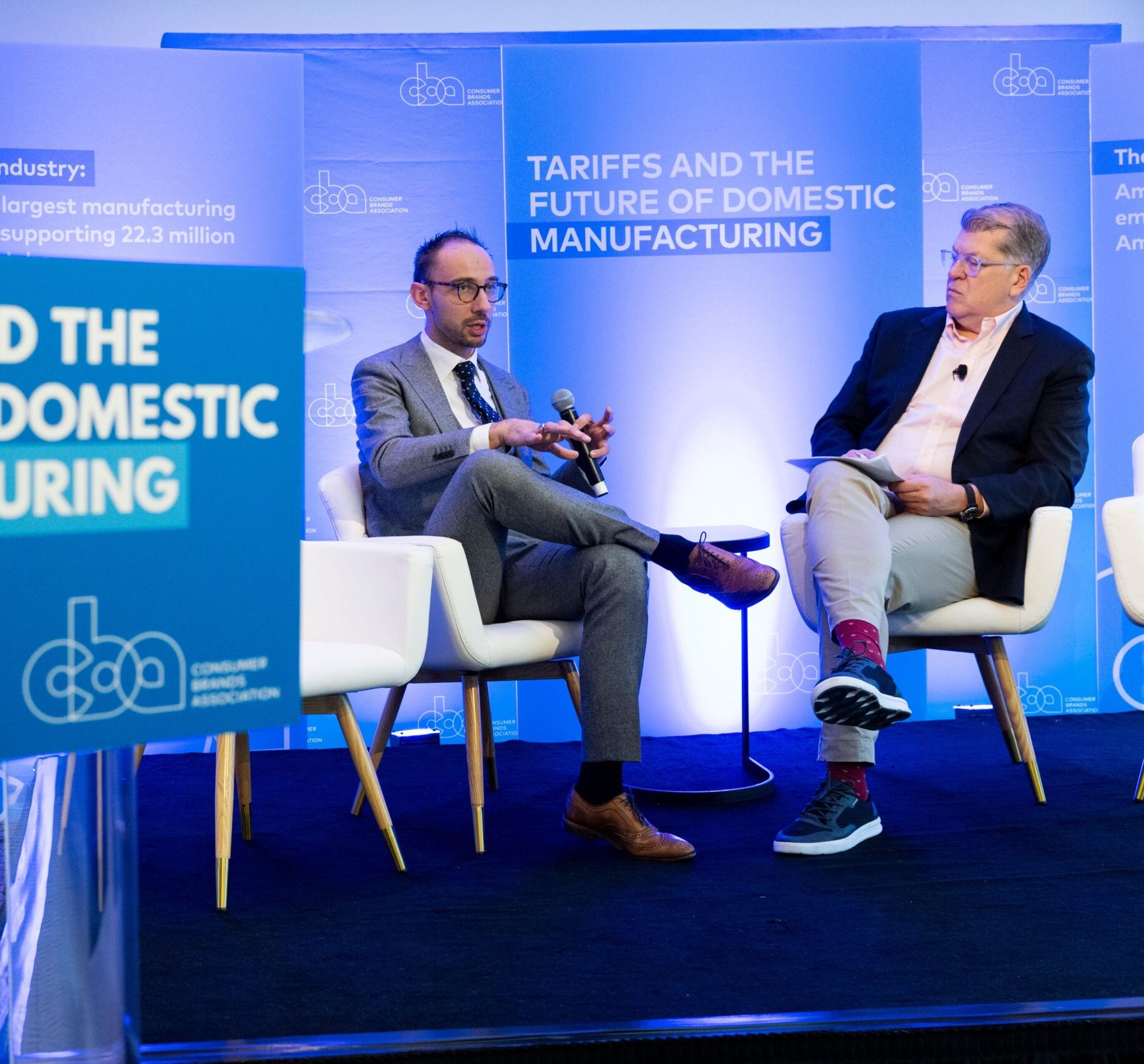 Tom Madrecki (left) talks with Steve Clemons (right) at Consumer Brands' event, "Tariffs and the Future of Domestic Manufacturing."